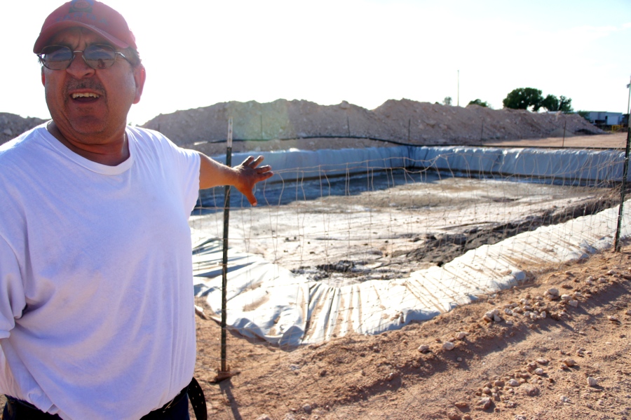 Linn Energy leaves chemical-laced frack water in open pits to evaporate, leaving behind contaminated sludge in residents' yards. (Credit Anna Simonton)