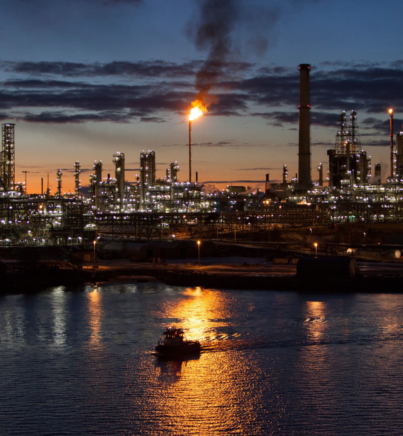 Refinery in Norway at night showing a flare