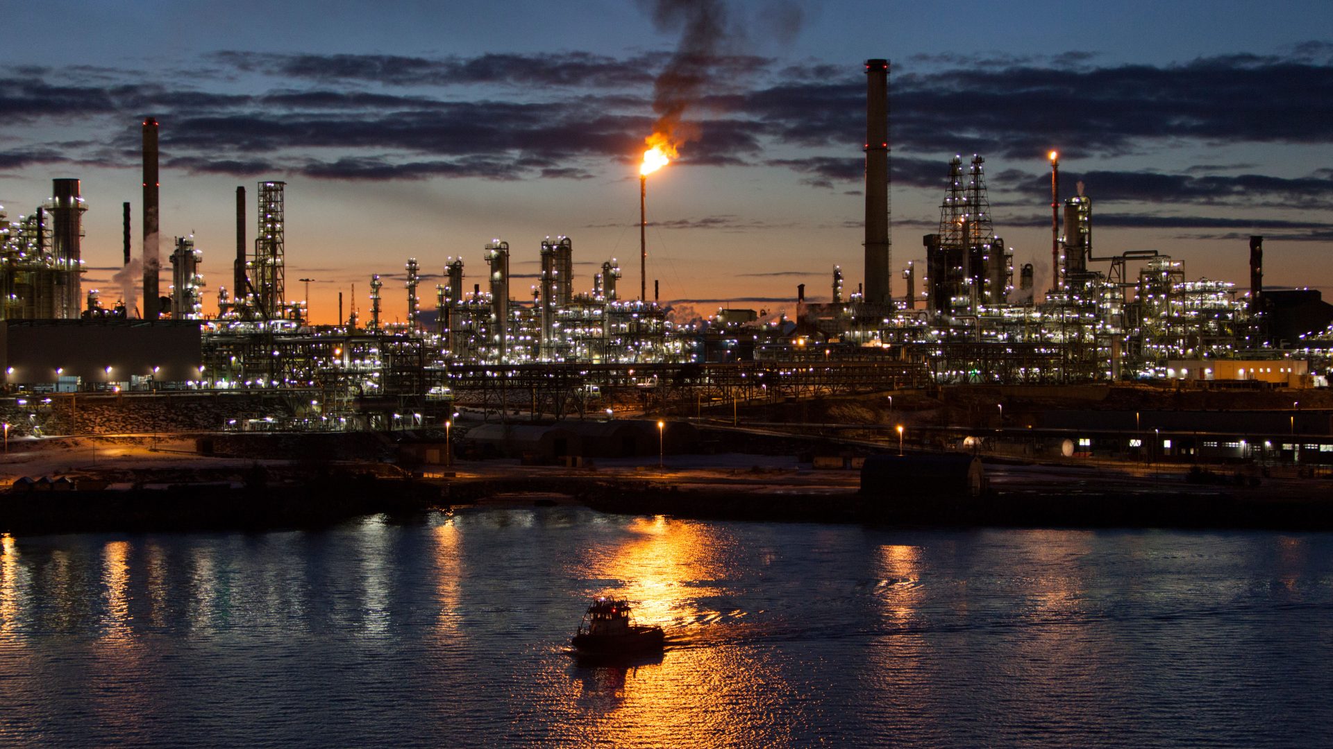 Refinery in Norway at night showing a flare