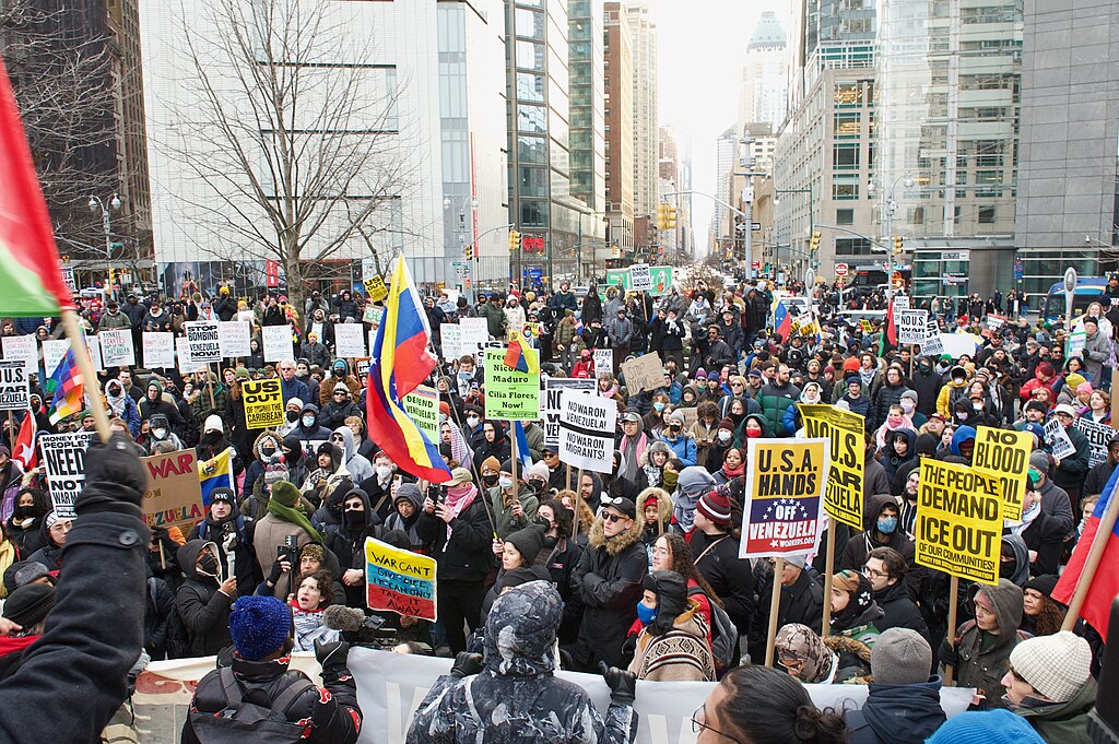 People gather in NYC to protest Trump's aggression in Venezuela.